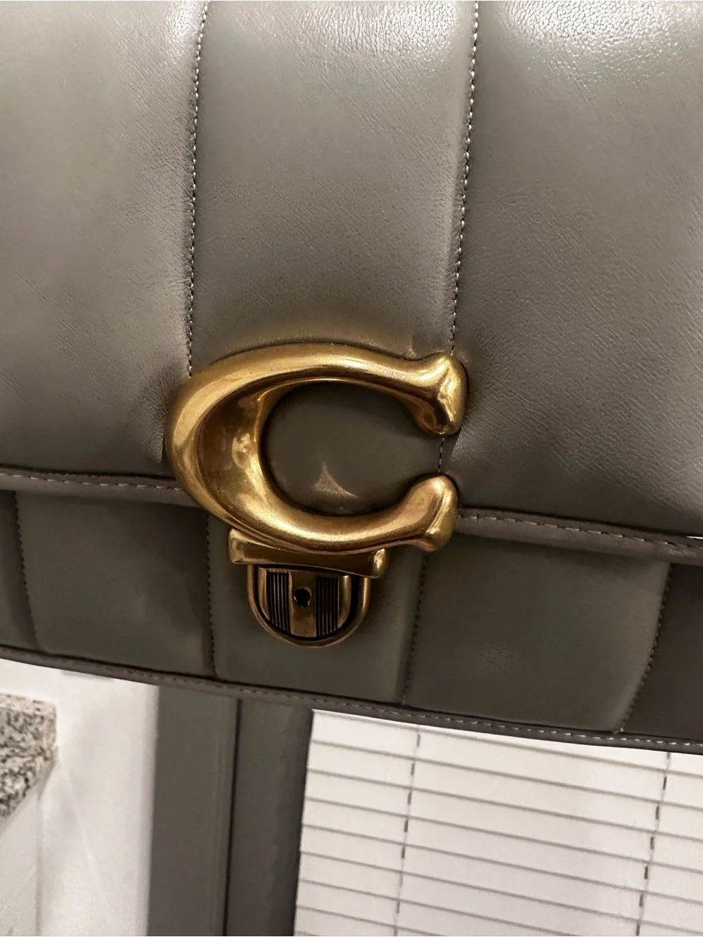 Coach compact quilted
